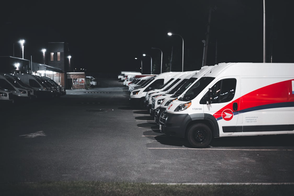 Fleet of commercial vehicles driving at night